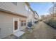 Townhome exterior featuring an outdoor patio, air conditioner, and a view of the shared green space at 7116 Fringe Flower Dr # 19, Austell, GA 30168