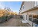 Townhome backyard featuring a patio, a wood fence, and an air conditioning unit at 7116 Fringe Flower Dr # 19, Austell, GA 30168