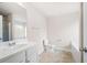 Bright bathroom with white vanity, toilet, tub, and shower at 7116 Fringe Flower Dr # 19, Austell, GA 30168