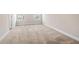 Spacious bedroom has neutral carpet, white trim, and plenty of natural light at 7116 Fringe Flower Dr # 19, Austell, GA 30168