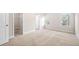 Cozy bedroom with neutral carpet, closet, and natural light at 7116 Fringe Flower Dr # 19, Austell, GA 30168