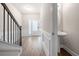 Entryway with staircase, wood floors, and a half bathroom at 7116 Fringe Flower Dr # 19, Austell, GA 30168