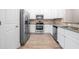 Stylish kitchen with stainless steel appliances and granite countertops at 7116 Fringe Flower Dr # 19, Austell, GA 30168