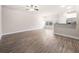 Open-concept living room with hardwood floors and plenty of natural light at 7116 Fringe Flower Dr # 19, Austell, GA 30168