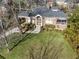 Brick home with large yard and driveway, seen from above at 1328 Harvard Ne Rd, Atlanta, GA 30306