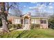 Charming brick home with a spacious lawn and mature trees at 1328 Harvard Ne Rd, Atlanta, GA 30306