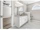 Modern bathroom with white vanity, marble flooring, and large mirror at 215 Prominent Loop, Mcdonough, GA 30253