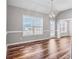 Spacious dining room with hardwood floors and large window at 215 Prominent Loop, Mcdonough, GA 30253