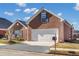 Brick ranch house with attached garage and manicured lawn at 215 Prominent Loop, Mcdonough, GA 30253