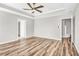 Large main bedroom featuring hardwood floors and ceiling fan at 215 Prominent Loop, Mcdonough, GA 30253