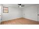 Spacious bedroom with light wood floors and ceiling fan at 2172 Briarlake Ne Trce, Atlanta, GA 30345