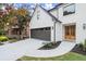 Modern home's front exterior, showcasing the dark garage door and landscaping at 2172 Briarlake Ne Trce, Atlanta, GA 30345