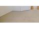 Clean carpeted basement with neutral walls and an interior door at 3318 Northcrest Rd # D, Atlanta, GA 30340