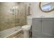 Updated bathroom features a walk-in shower, gray vanity, and modern toilet at 3318 Northcrest Rd # D, Atlanta, GA 30340