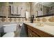 Bathroom with beige tile, a vanity with a sink, and a toilet at 3318 Northcrest Rd # D, Atlanta, GA 30340
