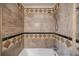 Bathroom with beige tile, shower, and bathtub at 3318 Northcrest Rd # D, Atlanta, GA 30340