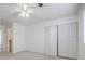 Bright bedroom with ceiling fan, large closet, and neutral walls at 3318 Northcrest Rd # D, Atlanta, GA 30340