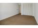 Spacious bedroom with neutral walls, carpet flooring, and built-in closet at 3318 Northcrest Rd # D, Atlanta, GA 30340