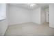 Spacious bedroom with carpeted floor, neutral walls, and an adjacent bathroom at 3318 Northcrest Rd # D, Atlanta, GA 30340