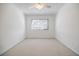 Bright bedroom with neutral walls and carpet, featuring a window with blinds at 3318 Northcrest Rd # D, Atlanta, GA 30340