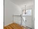 Bright foyer with hardwood floors, chandelier, and staircase at 3318 Northcrest Rd # D, Atlanta, GA 30340
