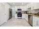 Modern kitchen with stainless steel appliances and granite countertops at 3318 Northcrest Rd # D, Atlanta, GA 30340