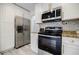 Updated kitchen with stainless steel appliances and granite countertops at 3318 Northcrest Rd # D, Atlanta, GA 30340