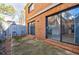 Brick patio with sliding glass doors leading inside at 3318 Northcrest Rd # D, Atlanta, GA 30340