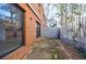 Small brick patio with sliding glass doors at 3318 Northcrest Rd # D, Atlanta, GA 30340
