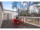 Deck with table, chairs, and grill; backyard view at 719 Courtenay Ne Dr, Atlanta, GA 30306