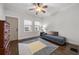 Living room with a daybed, hardwood floors, and rug at 719 Courtenay Ne Dr, Atlanta, GA 30306