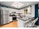 Modern kitchen with stainless steel appliances and breakfast bar at 22 Muncy Ct, Smyrna, GA 30080