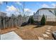 Landscaped backyard featuring a wooden fence and stone pathway at 2885 Field Spring Dr, Lithonia, GA 30058