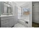 Main bathroom with double vanity, soaking tub, and walk-in shower at 2885 Field Spring Dr, Lithonia, GA 30058