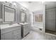 Main bathroom with double vanity, soaking tub, and walk-in shower at 2885 Field Spring Dr, Lithonia, GA 30058