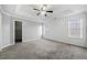 Bright bedroom with gray walls, carpet flooring, and a walk-in closet at 2885 Field Spring Dr, Lithonia, GA 30058