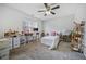 Bright bedroom featuring a comfy bed, workspace, and ample floor space at 2885 Field Spring Dr, Lithonia, GA 30058
