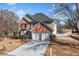 Brick two-story house with a two-car garage and well-maintained lawn at 2885 Field Spring Dr, Lithonia, GA 30058