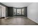 Spacious living room featuring large windows and gray walls at 2885 Field Spring Dr, Lithonia, GA 30058