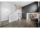 Open living area with high ceilings, gray accent wall, and kitchen view at 2885 Field Spring Dr, Lithonia, GA 30058
