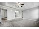 Main bedroom with gray walls, carpet flooring, and ensuite bathroom access at 2885 Field Spring Dr, Lithonia, GA 30058