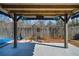 Covered patio with a concrete slab, wooden beams, and a fenced backyard at 2885 Field Spring Dr, Lithonia, GA 30058