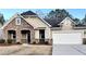 Beautiful two-story house with stone accents and a two-car garage at 3030 Parkland Vw, Atlanta, GA 30331