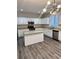 Modern kitchen with white cabinets, granite countertops, and stainless steel appliances at 3030 Parkland Vw, Atlanta, GA 30331