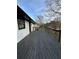 Wide stained back deck with a black railing at 5409 Mill Valley Dr, Douglasville, GA 30135