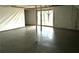 Spacious unfinished basement featuring concrete floors and a sliding glass door to the exterior at 5409 Mill Valley Dr, Douglasville, GA 30135