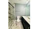 Bathroom with a white marble-look shower and floor tile and updated vanity at 5409 Mill Valley Dr, Douglasville, GA 30135