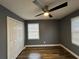 Bedroom featuring wood-look floors, ceiling fan and double-door closet at 5409 Mill Valley Dr, Douglasville, GA 30135