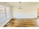 Inviting dining room with wood flooring and contemporary lighting fixture at 5409 Mill Valley Dr, Douglasville, GA 30135