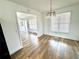 Dining area with hardwood floors, natural light, and view of the front door at 5409 Mill Valley Dr, Douglasville, GA 30135